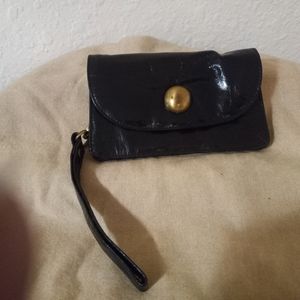 Genuine leather wristlet with inside floral lining & 3 zip parts